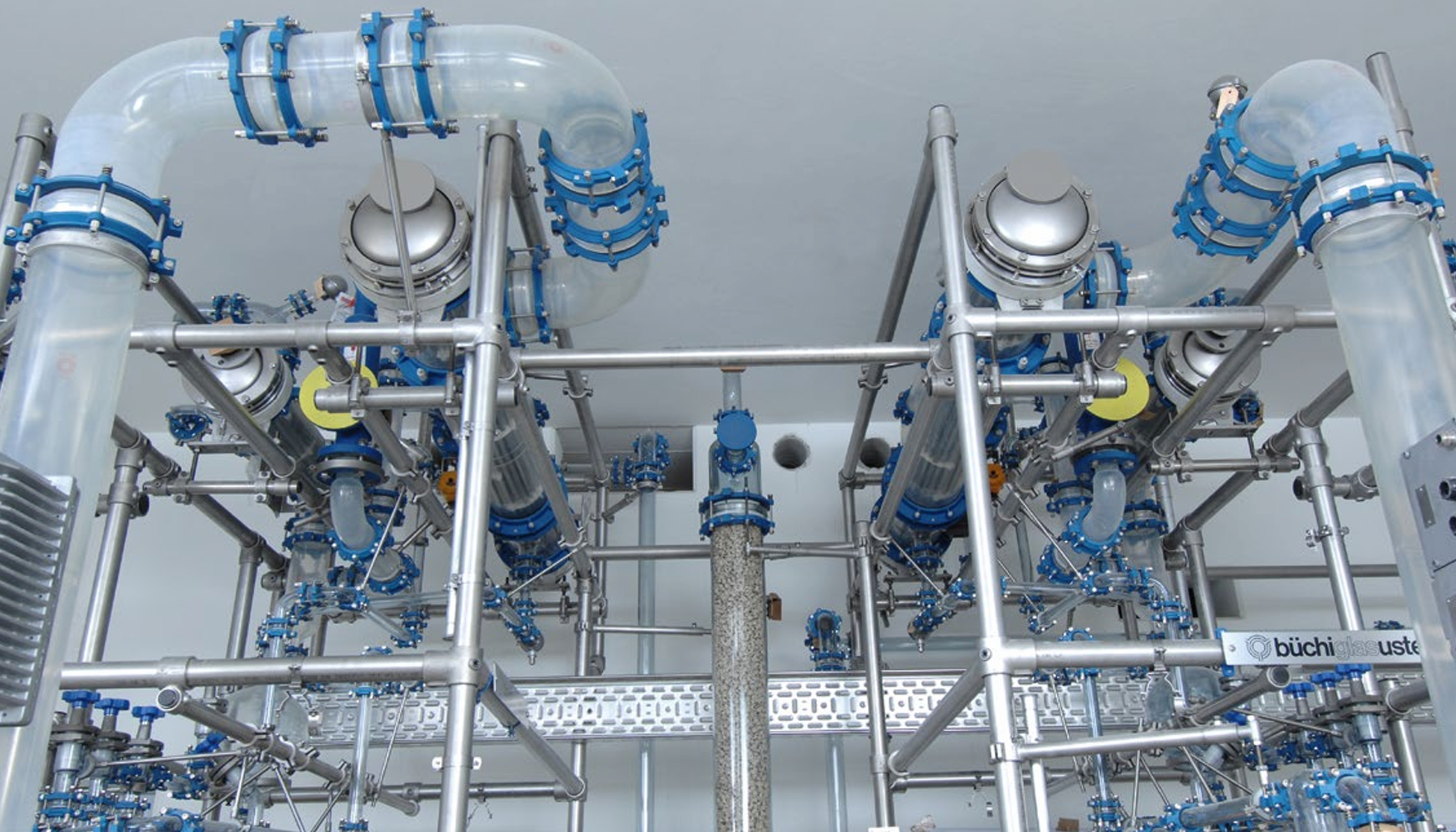 Production distillation overhead with silicon carbide shel and tube heat exchanger with rectification system